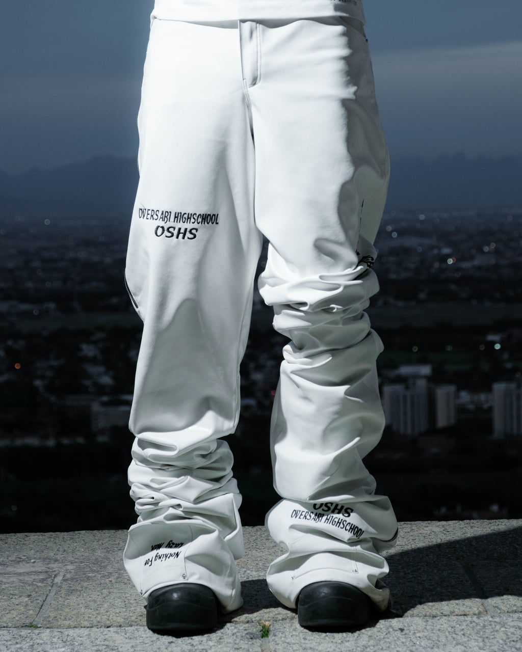 White Oversabi Extra Long Pants by OVERSABI HIGHSCHOOL, showing the full length fabric and fit on a model.