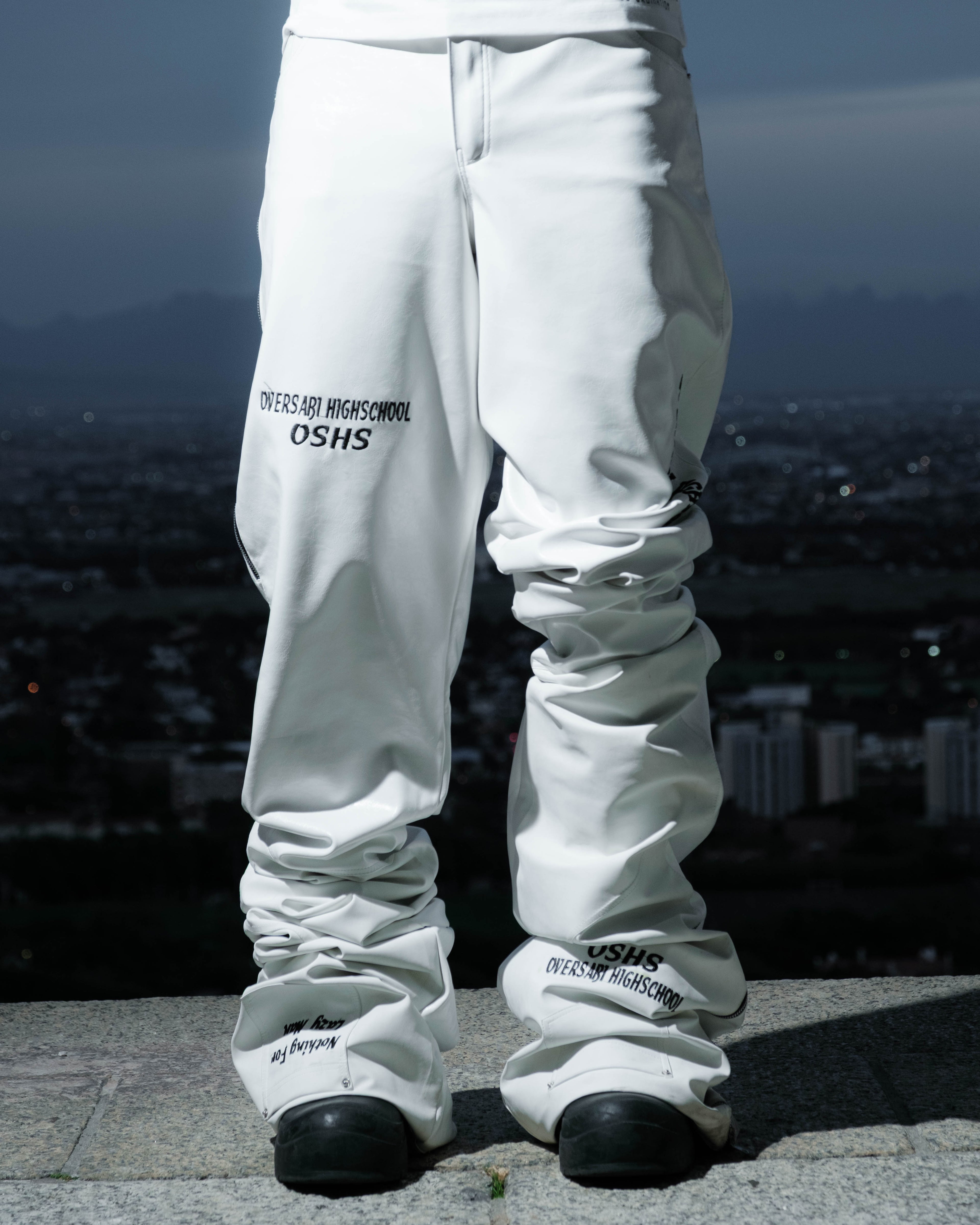 White Oversabi Extra Long Pants by OVERSABI HIGHSCHOOL, showing the full length fabric and fit on a model.