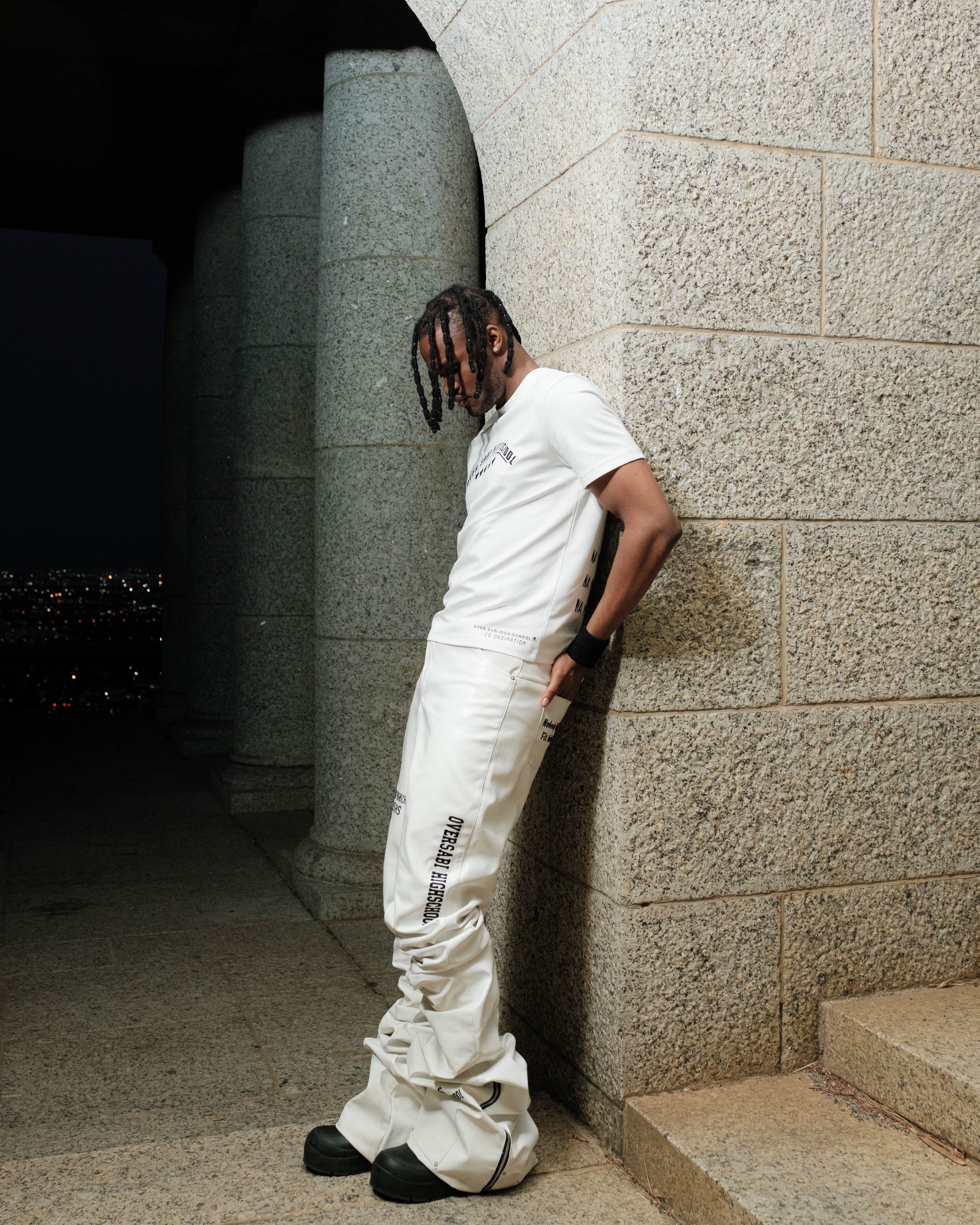 White Oversabi Extra Long Pants by OVERSABI HIGHSCHOOL, showing the full length, slim fit design, and fabric details.