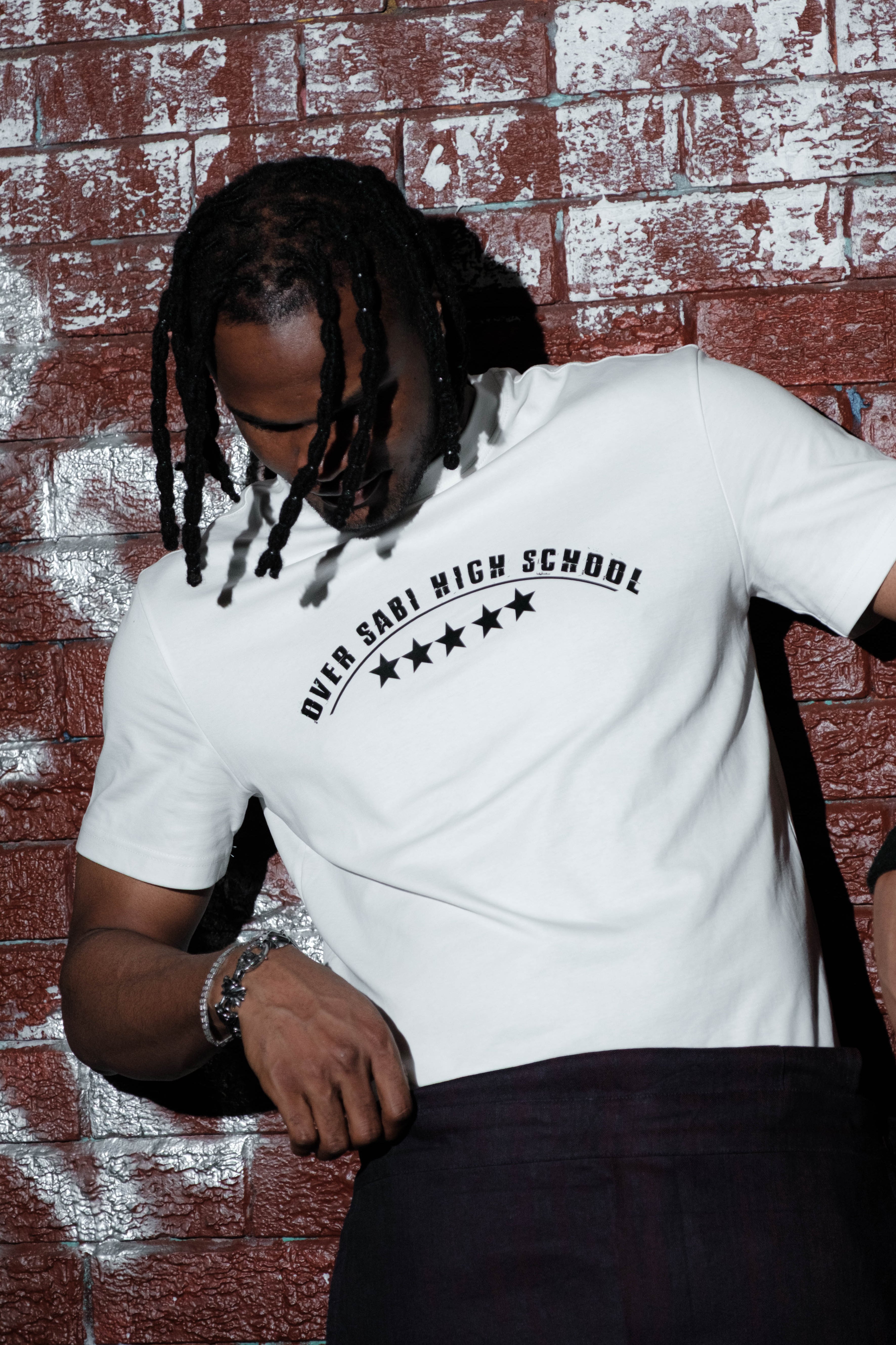White OSHS Co-Ordinated T-Shirt by OVERSABI HIGH SCHOOL, front view showing logo and casual fit.